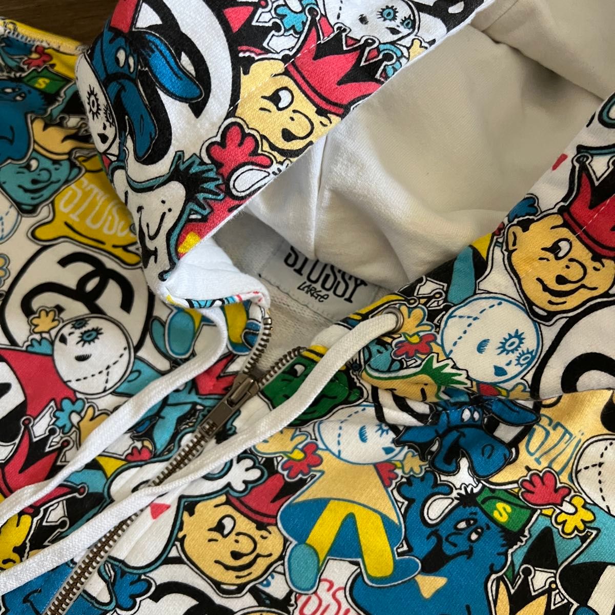 STUSSY 総柄 HEADZ ジップアップパーカー マルチカラー キャラクター