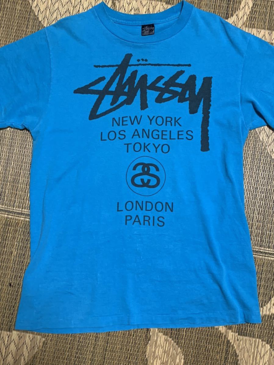STUSSY WORLD TOUR オールド　ステューシー ワールドツアー Tシャツ サイズL ブルー　光沢黒タグ　80s