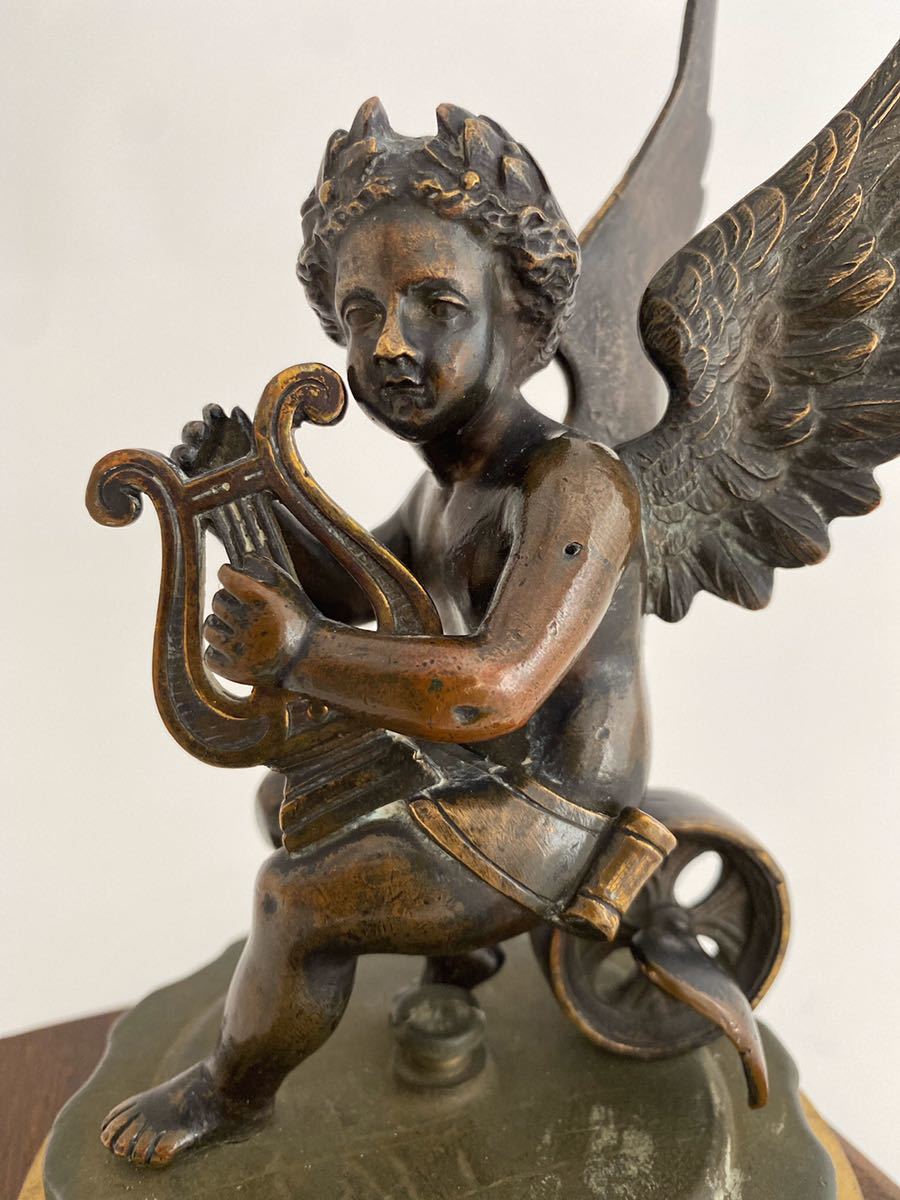 Winged Cherub,Sitting on a winged wheel. koto ... angel 1910 period. Britain made mascot,1870 period. sculpture bronze made FoundryMarks