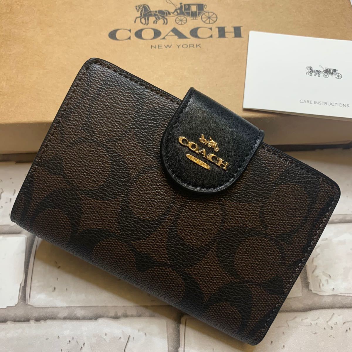 新品 COACH コーチ 二つ折り財布 ブラウンブラック アウトレット