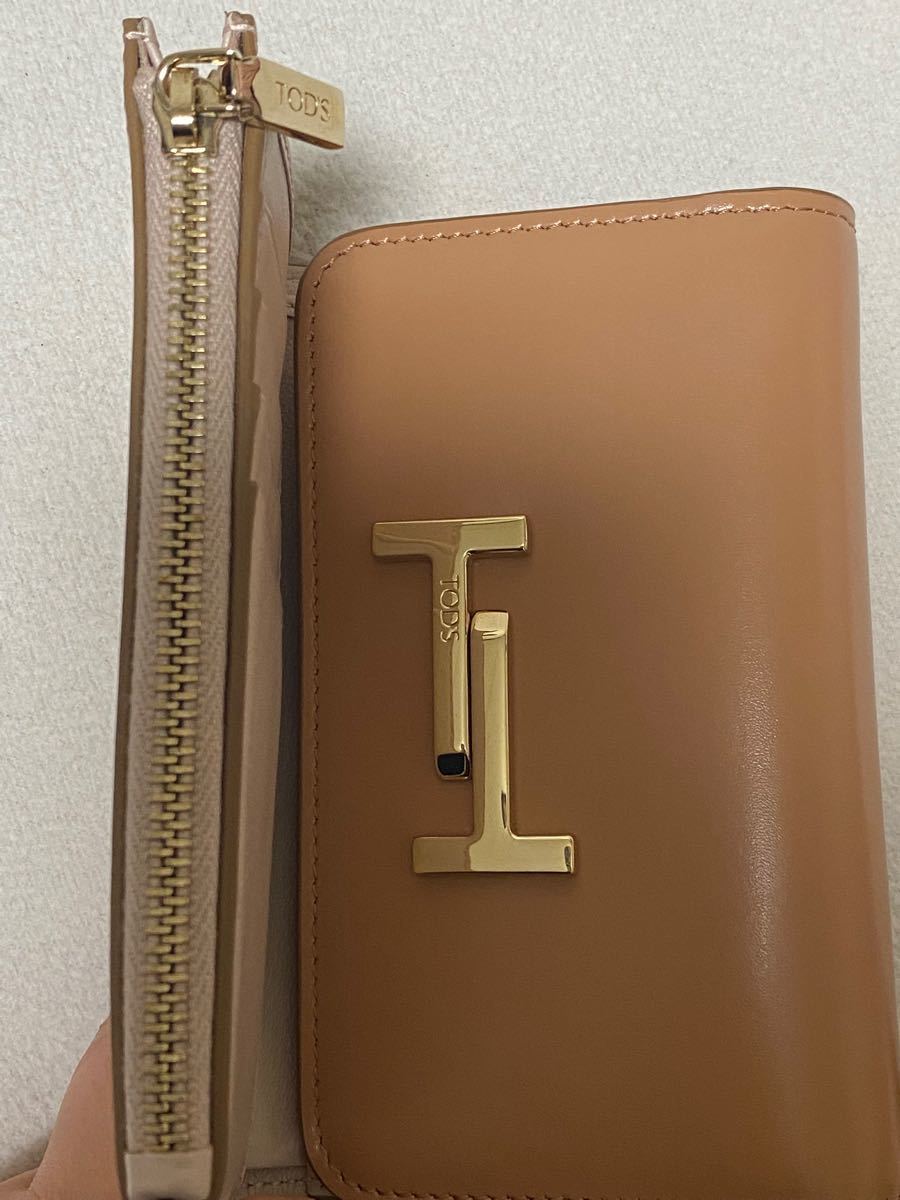 新品 トッズ 三つ折り財布 ceratinxd.com