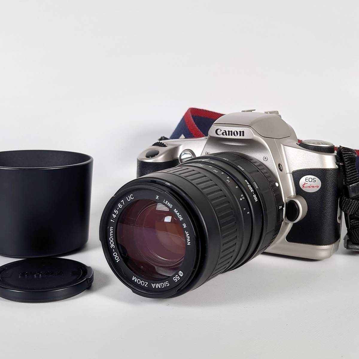 カメラ フィルムカメラ シャッターOK Canon New EOS Kiss フィルム一眼レフカメラ SIGMA 100-300mm F4.5-6.7 UC 望遠 ズーム  レンズ キヤノン AF 現状品
