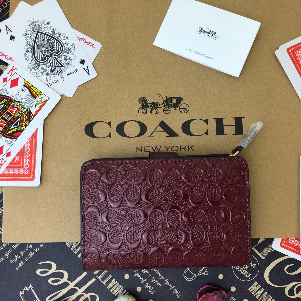 大特価!! COACH コーチ ︎✿エンジ エナメル 二つ折り財布 tdreebcom.ps