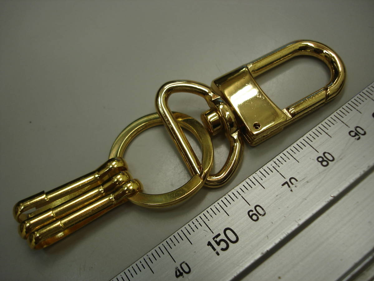 *[ excellent article .]* new goods gold color metal key holder strap na ska nkala navi two -ply . hook .. netsuke rare article TREKS by Louis Vuitton metal fittings . same shape 