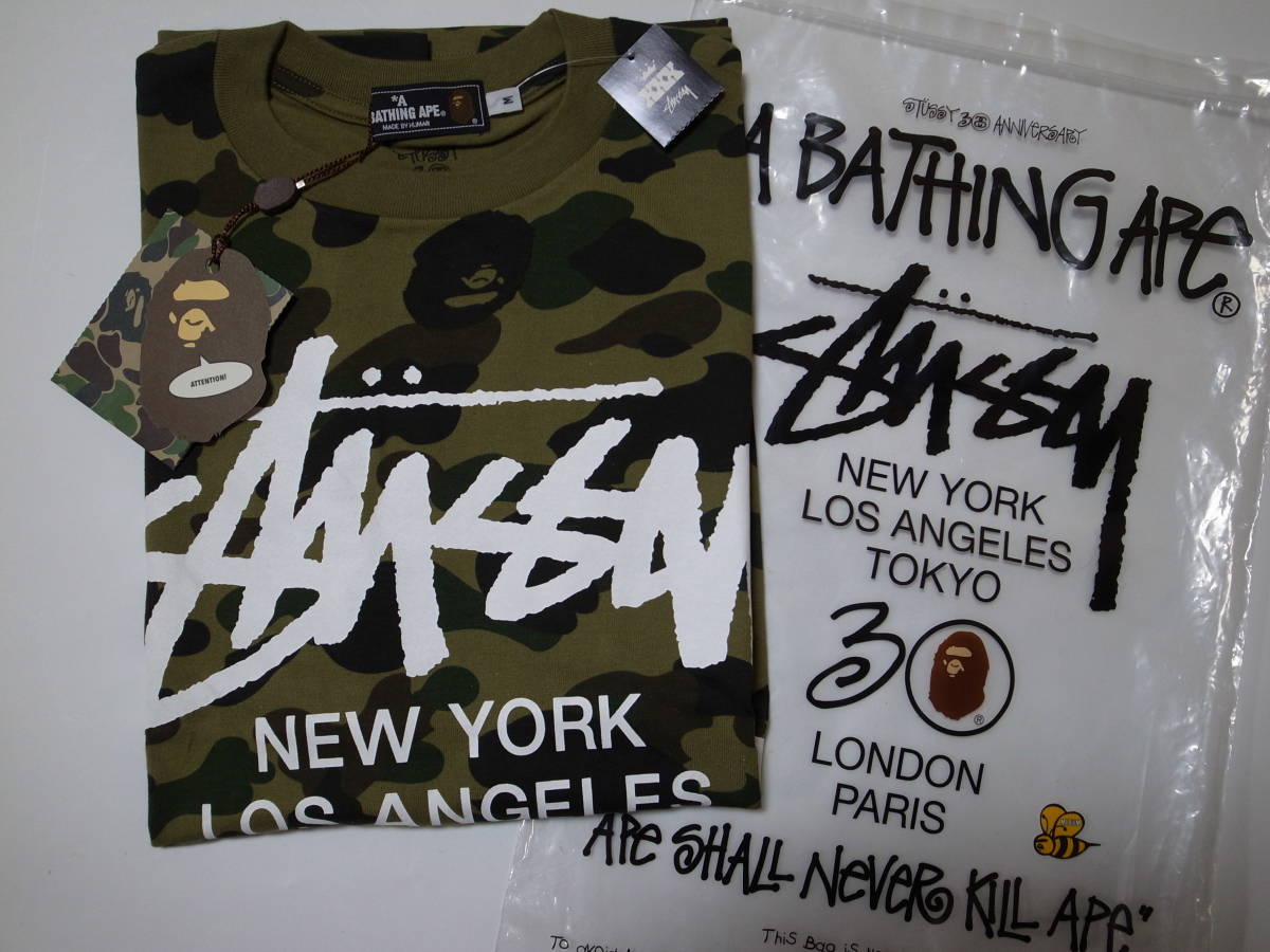 激レアコラボ・稀少★A BATHING APE ×STUSSY ★ステューシー 30周年記念Tシャツ★猿迷彩柄・ワールドツアー★グリーン★M