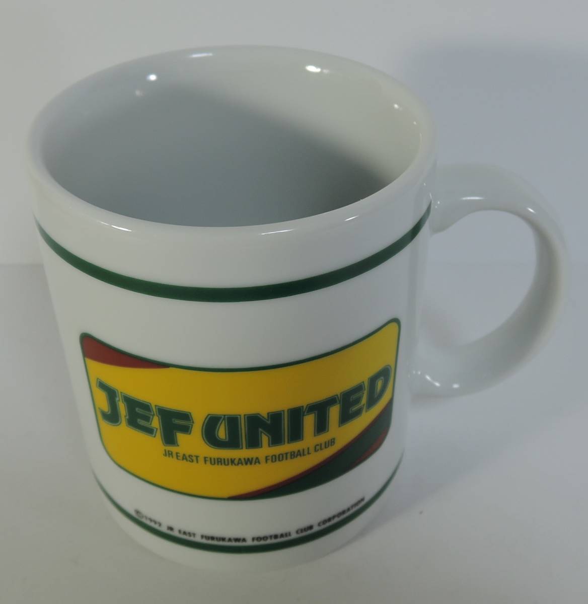 ☆04M■JR東日本/古川サッカークラブ/ジェフユナイテッド　マグカップ　陶器製■1992　未使用_画像1