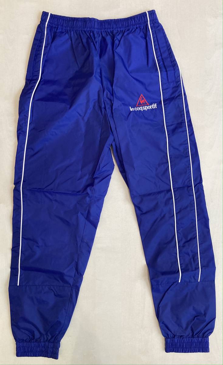 le coq sportif QS-4703 нейлон окно брюки L-O не использовался Le Coq Wind Pants брюки-джоггеры to рубин on неиспользуемый товар 90s