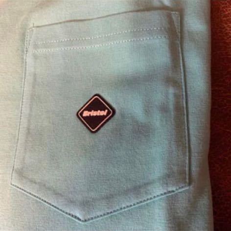 F.C.Real Bristol MINI EMBLEM POCKET TEE | bioimune.com.br