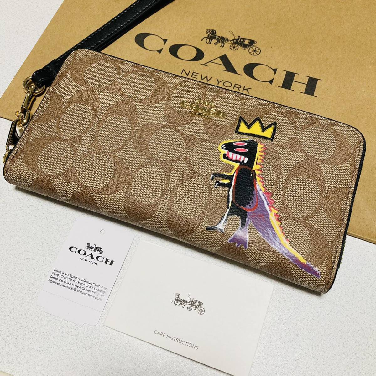 COACHコーティングシグネチャー 恐竜 レキシー ジャン ミシェル