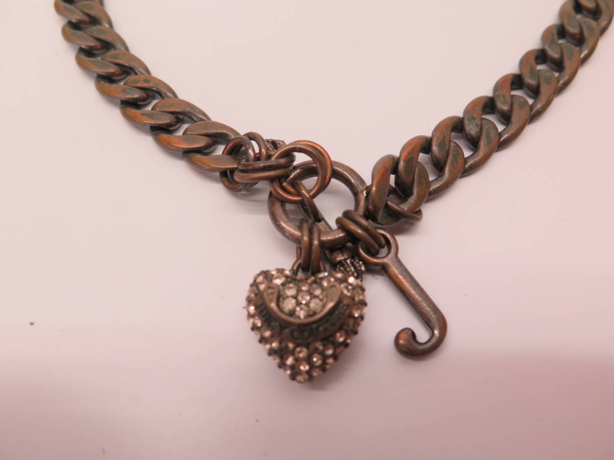 Juicy Couture Juicy Couture necklace pink Stone. Heart red copper color case attaching 