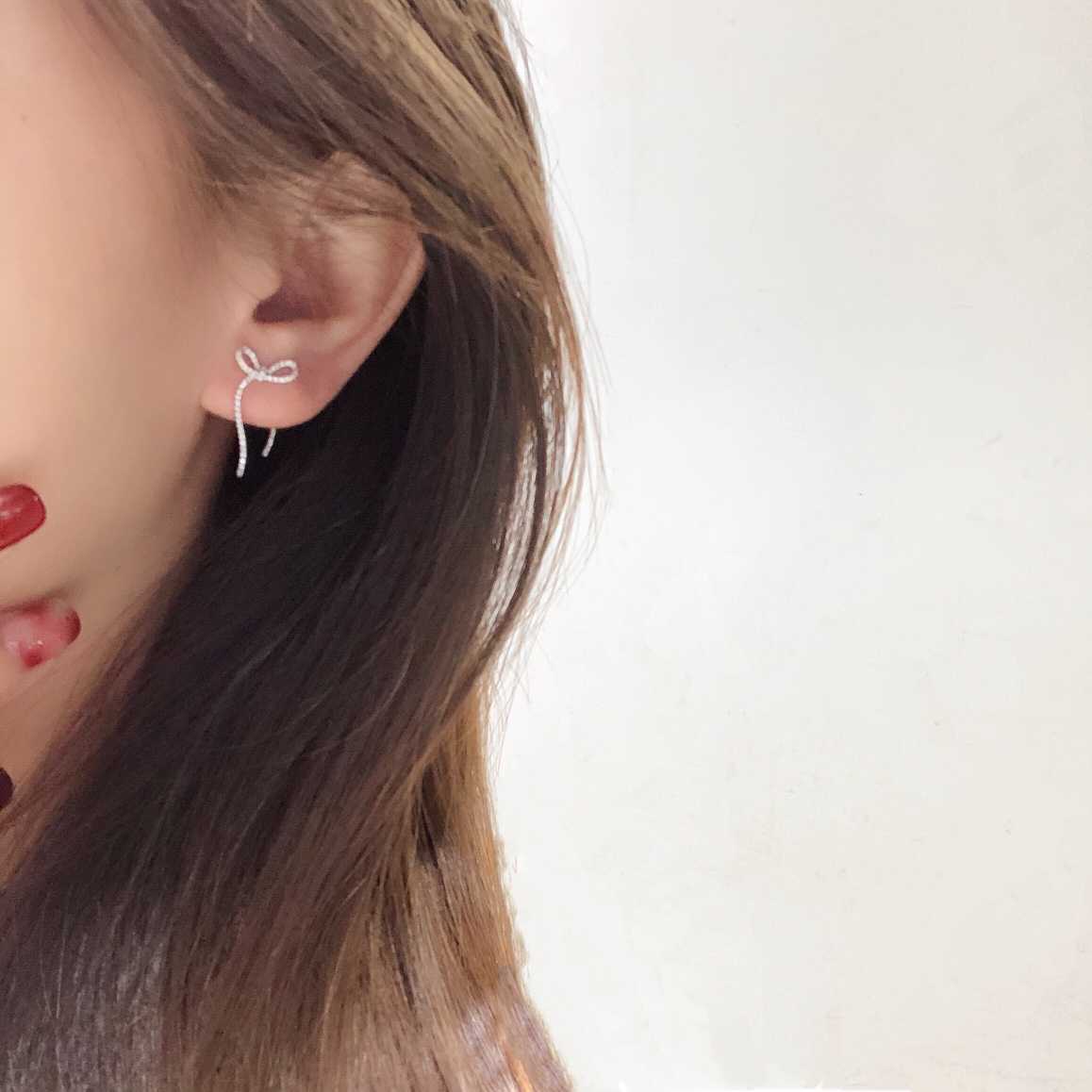 リボンモチーフ 天然ダイヤモンドピアス0.4ct k18 | artistasebandas.pt