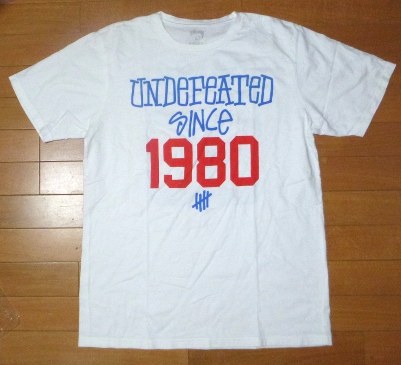 USED送料込! ◆ STUSSY x UNDEFEATED プリント T-シャツ ◆ SizeL 30周年記念