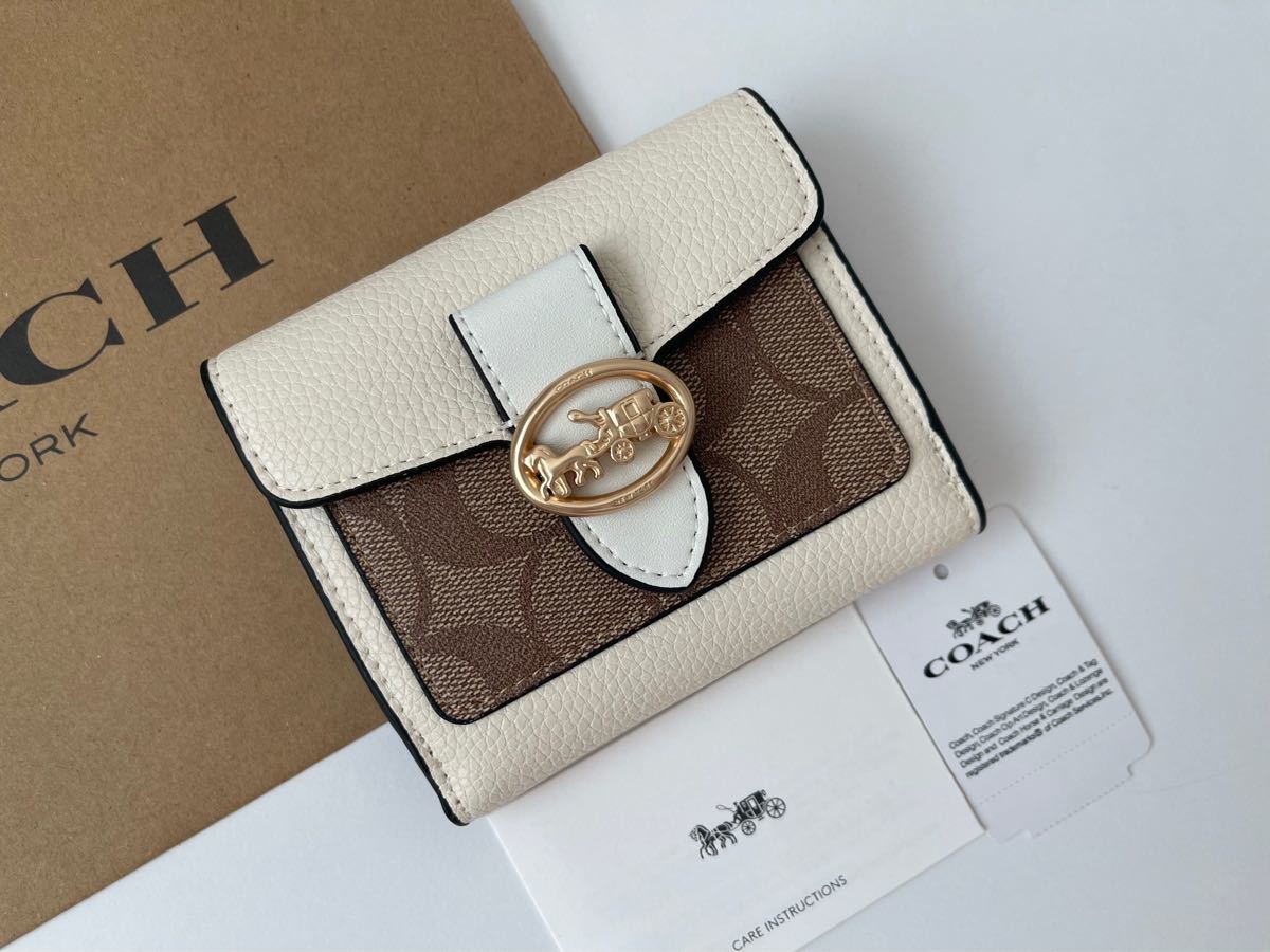 COACH 2つ折り財布 馬車金具 ブラック シグネチャー