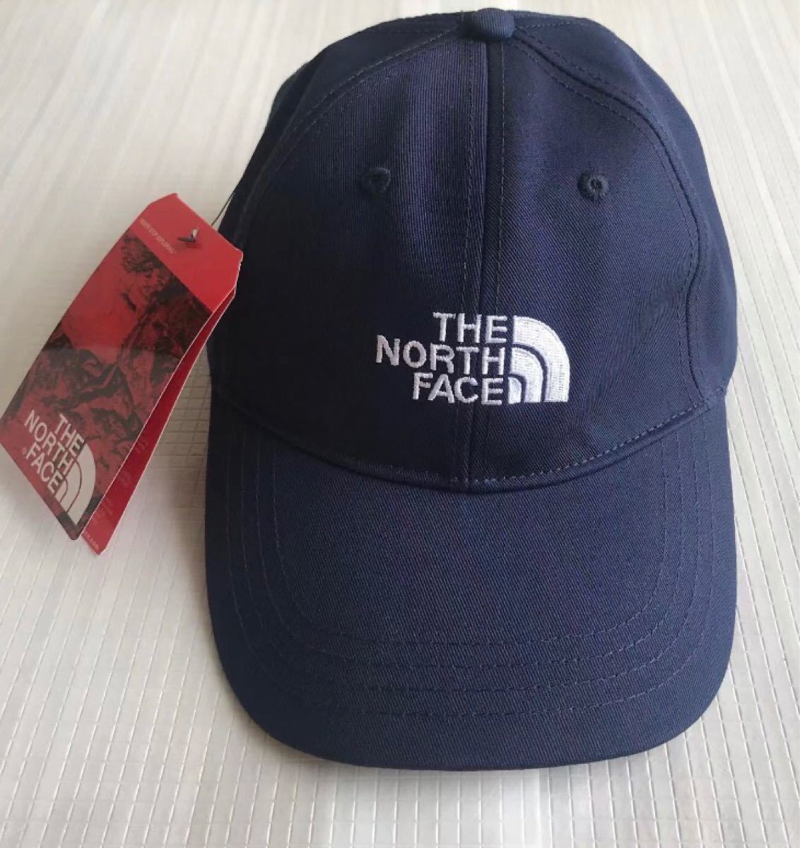 ［新品、未使用］ 人気 THE NORTH FACE キャップ フリーサイズ　ノースフェイス 帽子ブルー&ホワイトの刺繍ロゴ