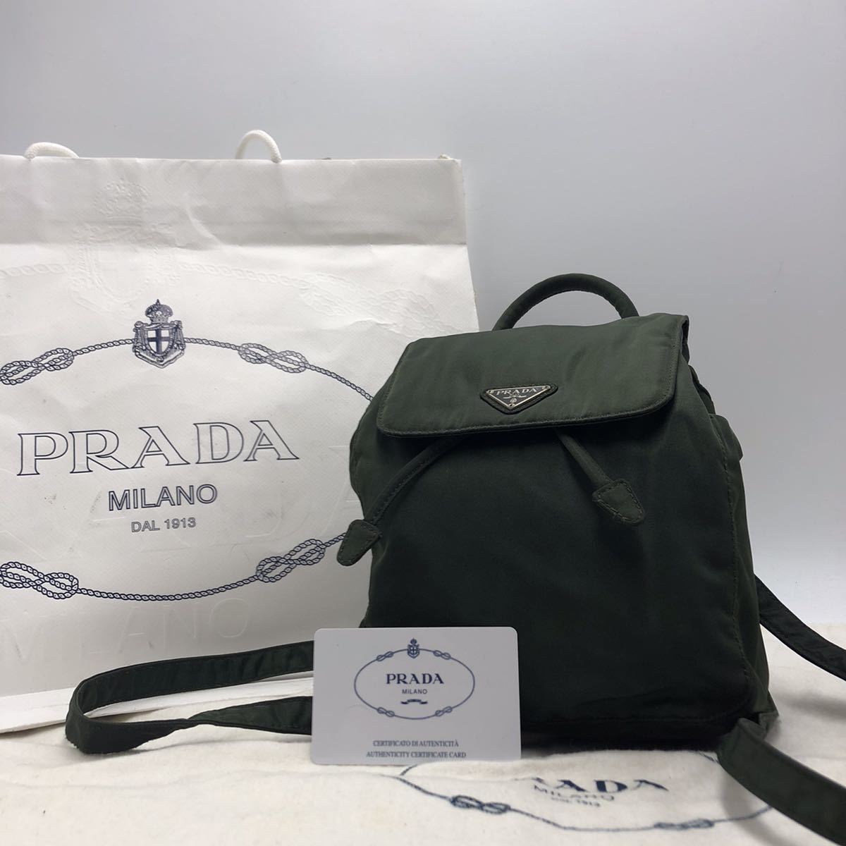 1円【極美品】 PRADA リュック 巾着 ミニ 三角プレート テスートナイロン 軽量 白タグ プラダ バックパック ショルダーバッグ カーキ_画像1