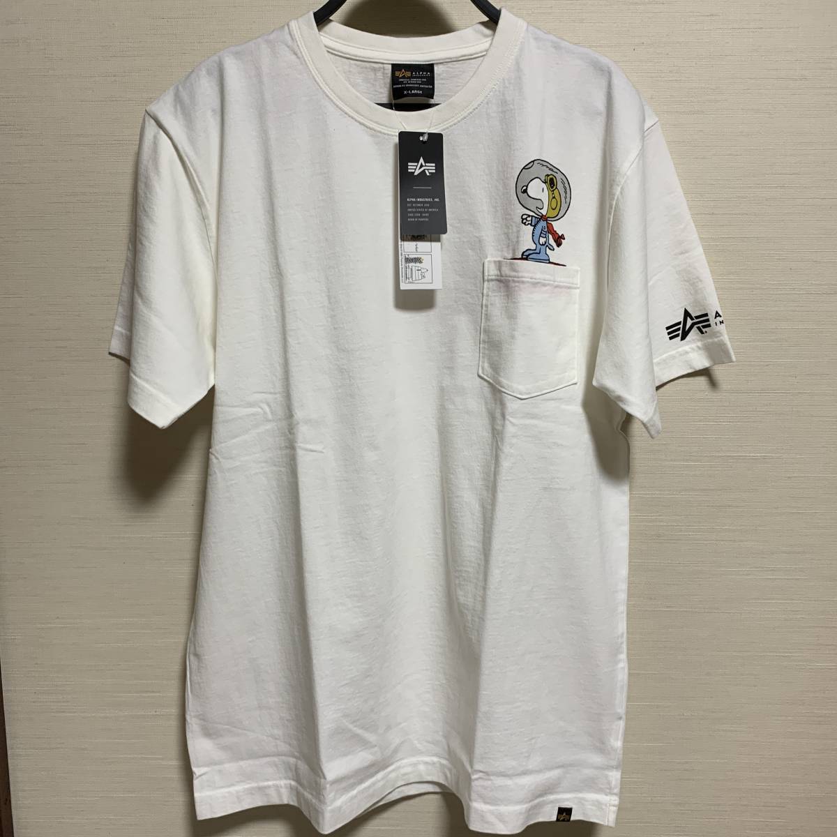 ALPHA INDUSTRIES (アルファ・インダストリーズ) PEANUTS スヌーピー MEN 半袖 Tシャツ ポケット 白色 XLサイズ コラボ (タグ付き未着用品)の画像1