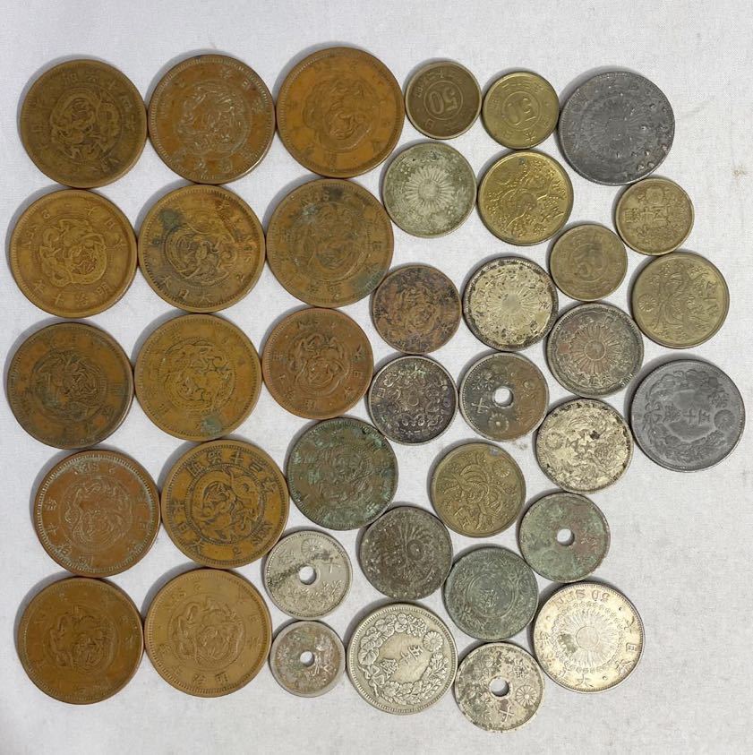 NN0707 108 遺品整理 蔵出し 年代物 古銭 硬貨 小型 銀貨 50銭 1銭 2銭 10銭 100円 など 穴あき 穴無し 大量セット まとめて 1円スタート(その他)|売買されたオークション情報、yahooの商品情報をアーカイブ公開 - オークファン(aucfan.com) NN0707 108 遺品整理 蔵出し 年代物 古銭 硬貨 小型 銀貨 50銭 1銭 2銭 10銭 100円 など 穴あき 穴無し 大量セット まとめて 1円スタート(その他)|売買されたオークション情報、yahooの商品情報をアーカイブ公開 - オークファン(aucfan.com)