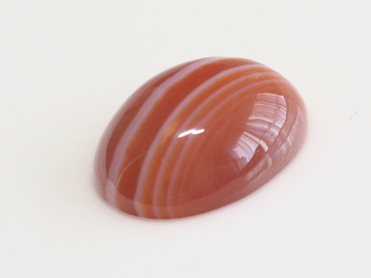  large grain red menou.... . size approximately 17.8x12.9x5.9mm oval kaboshon weight approximately 9.48ct