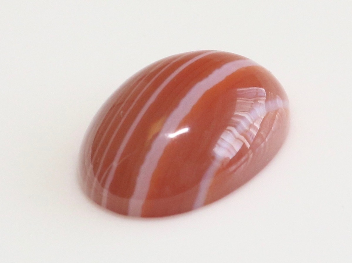  large grain red menou.... . size approximately 17.8x12.9x5.9mm oval kaboshon weight approximately 9.48ct