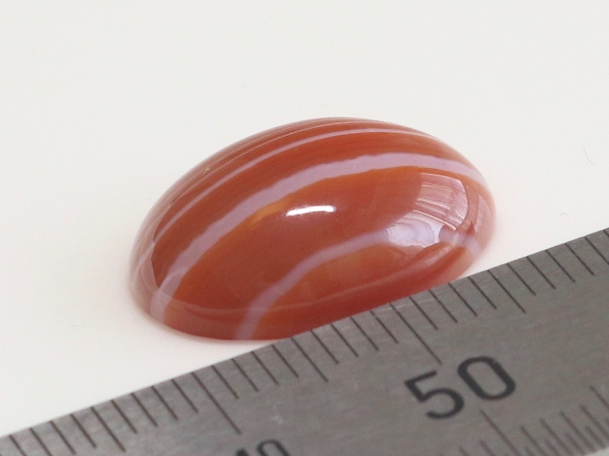  large grain red menou.... . size approximately 17.8x12.9x5.9mm oval kaboshon weight approximately 9.48ct