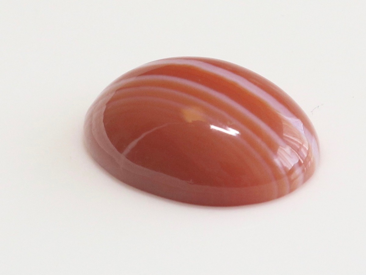  large grain red menou.... . size approximately 17.8x12.9x5.9mm oval kaboshon weight approximately 9.48ct