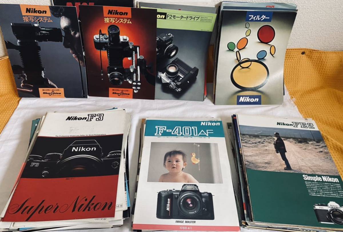 Nikon camera lens. pamphlet 150 part and more 1980 year ~1985 year mania shide .. .