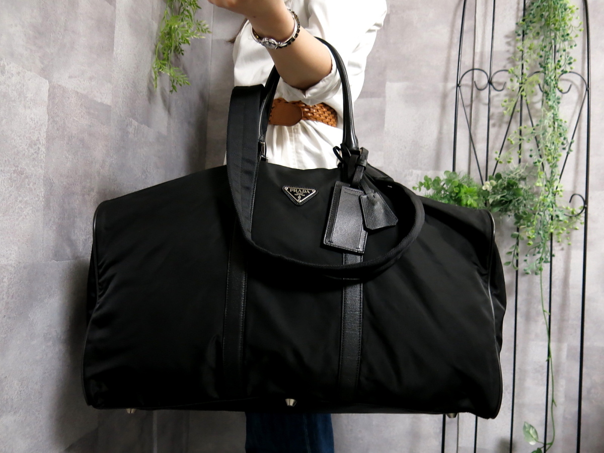 人気沸騰】 旅行鞄 美品✨PRADA キャリーバック 三角プレート 旅行鞄