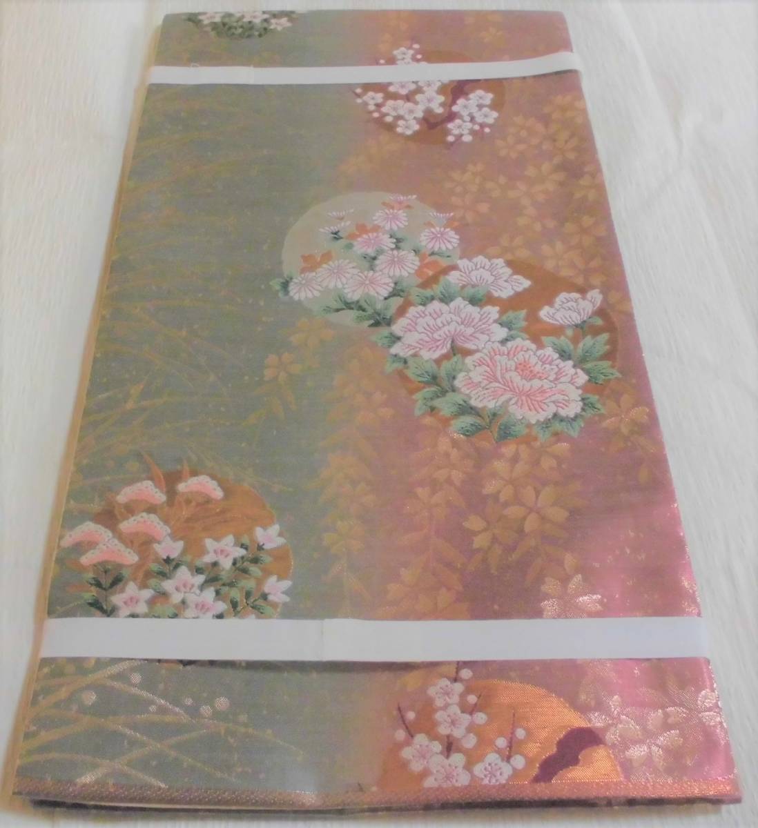 正絹／牡丹、梅、菊、桔梗、桜など季節の花が織られた袋帯／未使用