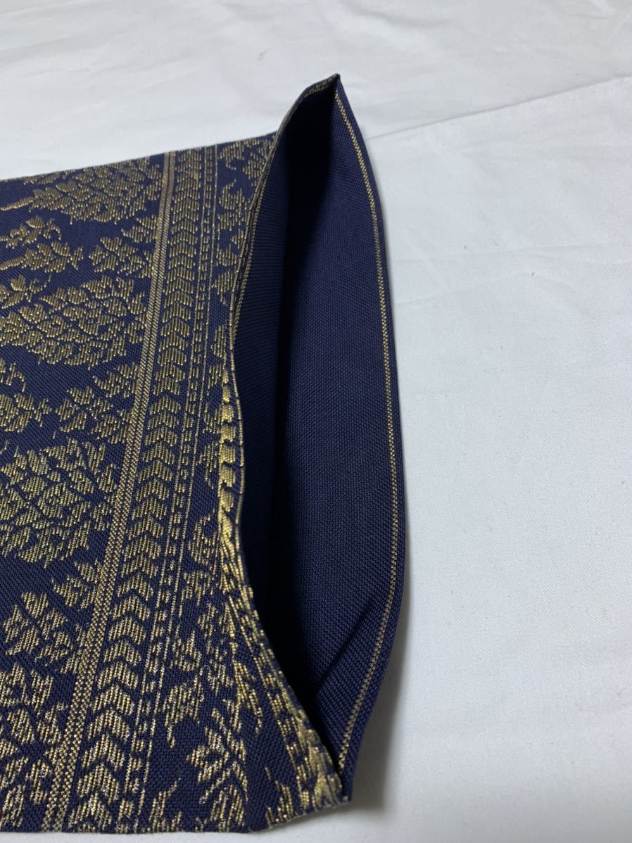 名古屋帯 正絹ゴブラン織り おそめ仕立て六通柄 濃い紺地に金糸の更紗 