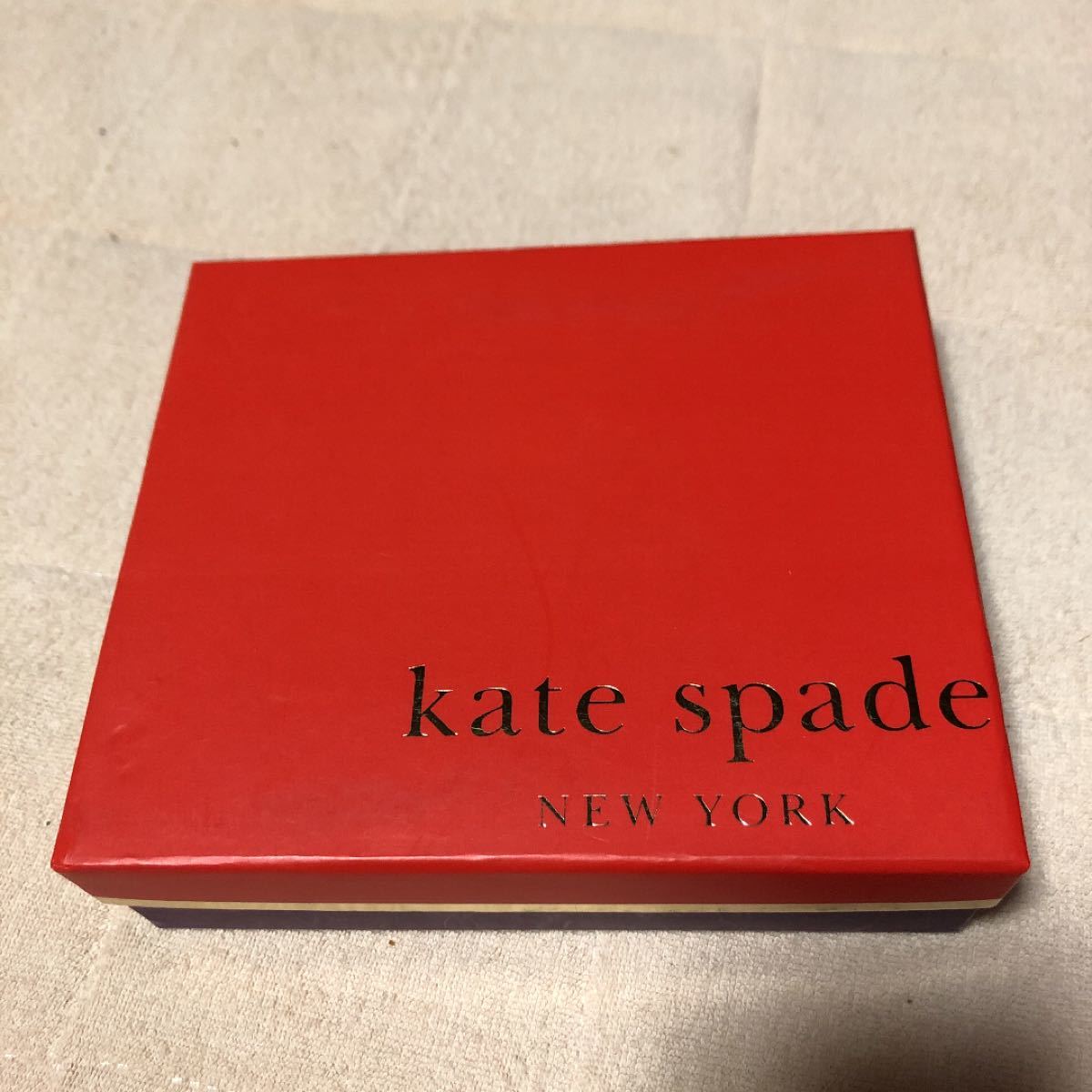 最終お値下げ！未使用☆Kate spade ケイトスペイド　本革　ゴールドのミニリボンポーチ