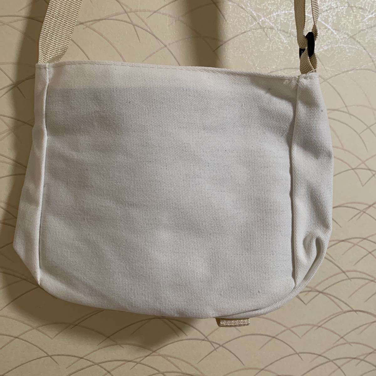  man and woman use out with pocket white cloth shoulder bag 