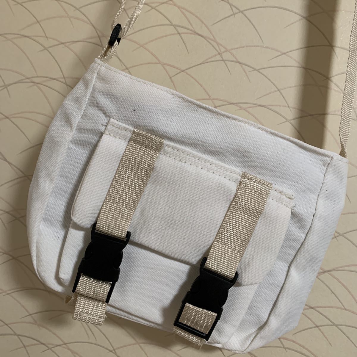  man and woman use out with pocket white cloth shoulder bag 