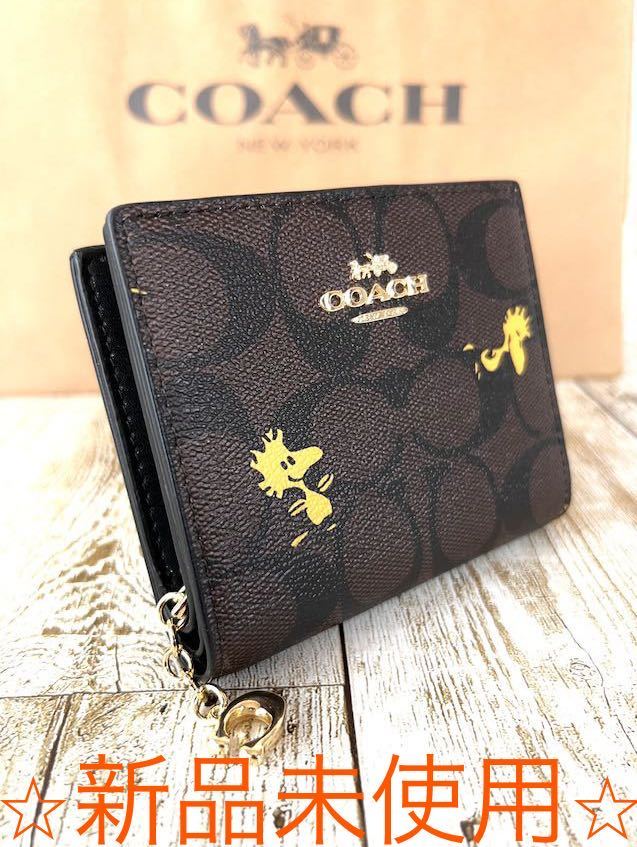 世界的に COACHコーチ×PEANUTS スナップウォレット ウッドストック柄