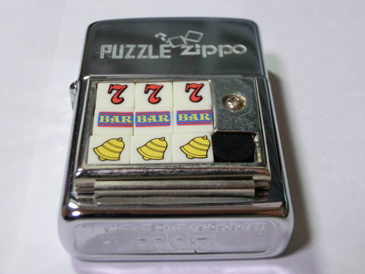 zippo ジッポー PUZZLE ZIPPO スロット柄 1995年製 年代物 絶版 未使用 ...