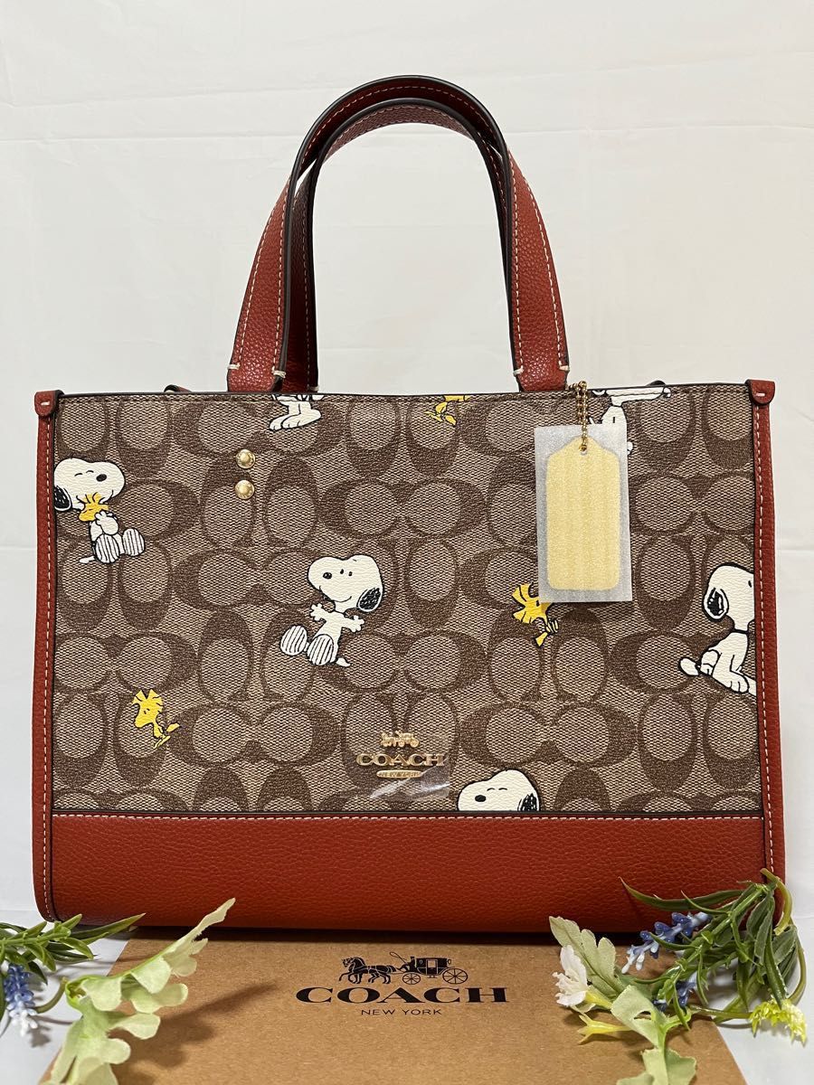 COACH X PEANUTSスヌーピーデンプシー キャリーオールシグネチャー