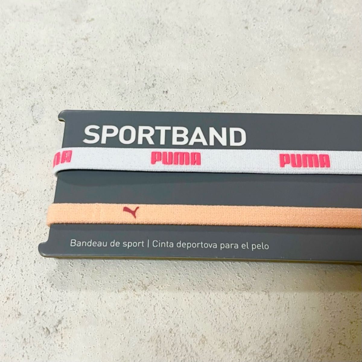新品・送料無料　PUMA細いヘアバンド2本セット ホワイト（ピンク文字） ライトオレンジ