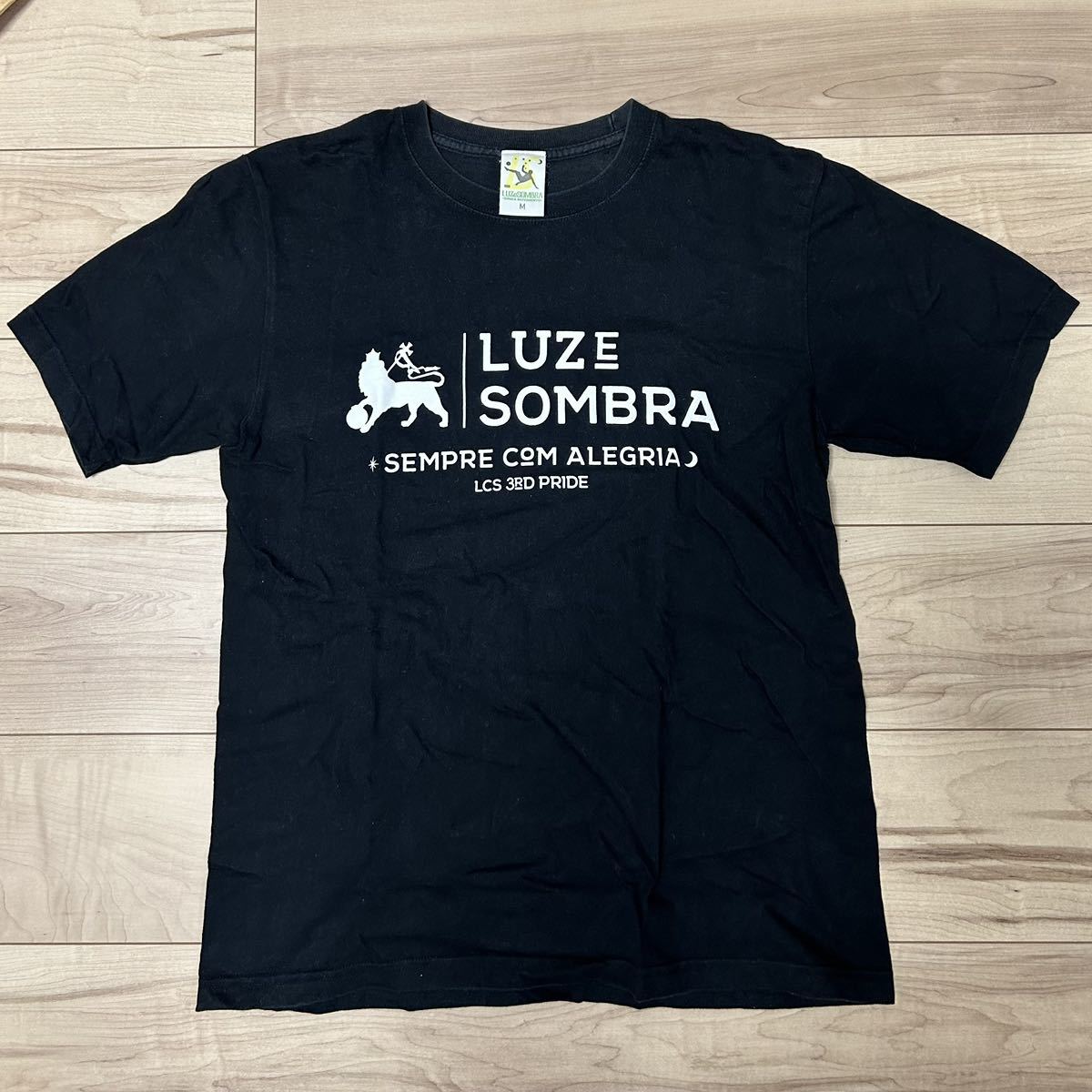 【Mサイズ】即決！LUZ e SOMBRA LCS 3周年記念T-SHIRT(ブラック) 中古品 ルースイソンブラ Tシャツ カジュアル 限定販売品_画像1