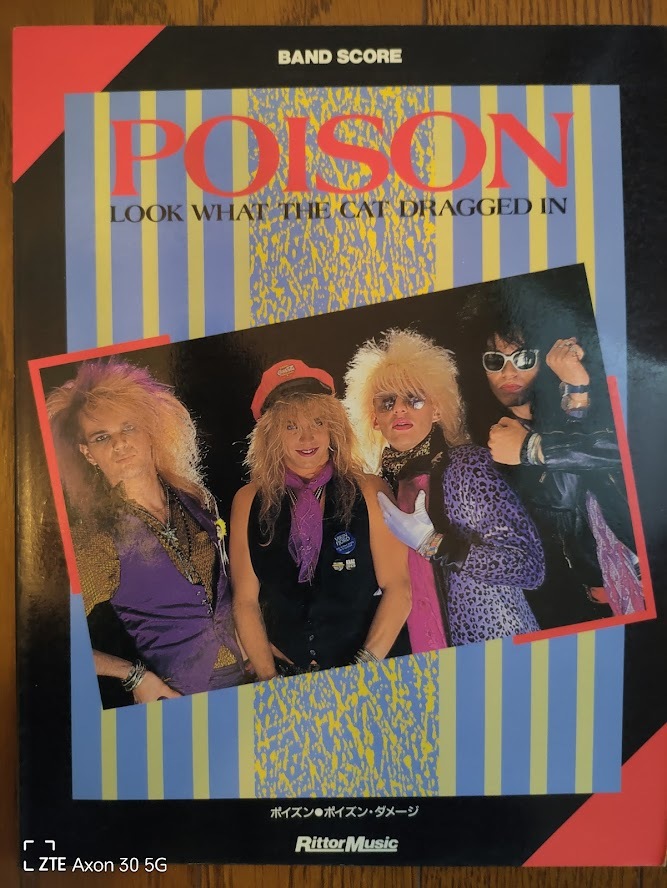 POISON/LOOK WHAT CAT DRAGGED INのバンドスコア　中古です。_画像1