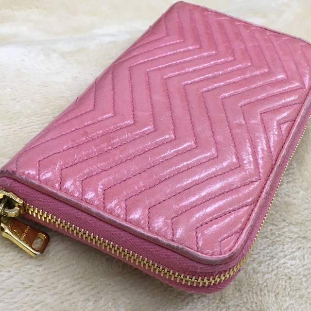 MIUMIU MiuMiu long wallet ribbon equipment ornament leather leather round fastener metal fittings plating Gold color pink guarantee card attaching 
