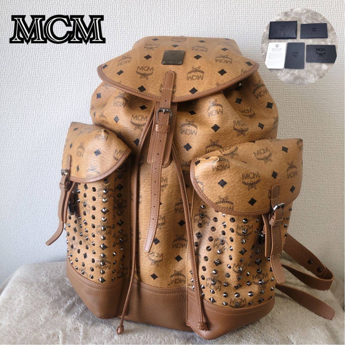 激レア☆人気 MCM エムシーエム レザーリュック バックパック ヴィセトス 総柄 スタッズ ブラウン オレンジ ブランデンブルク 小冊子付き 