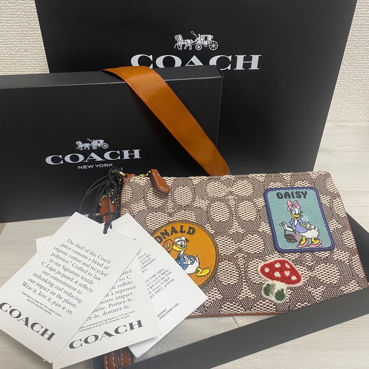 新品☆コーチCOACH☆桜色ピンクレザーシグネチャーラウンドジップ長