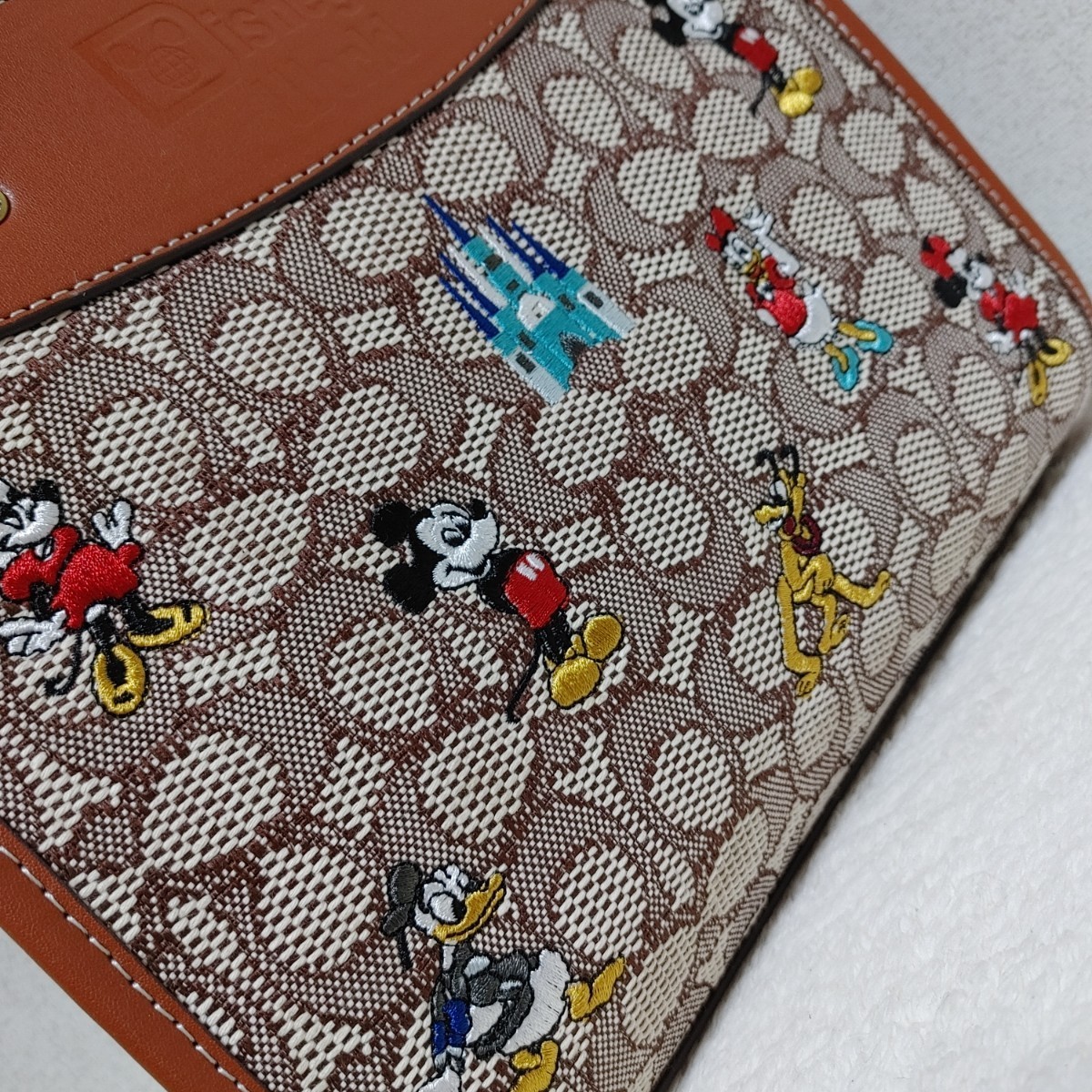 送料無料 coach トートバッグ ショルダー ローグ25 ディズニー