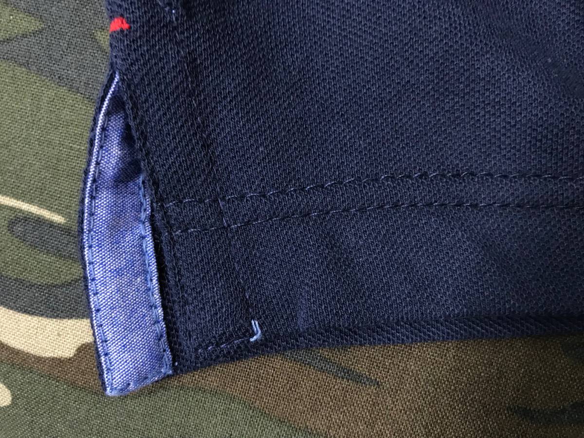 USA限定 「XL」 Tommy トミーヒルフィガー CUSTOM FIT カスタムフィット ワンポイント フラッグ POLOシャツ ポロシャツ 綿100% 水色 ペール_裾のサイドはスリットあり(色違い画像)