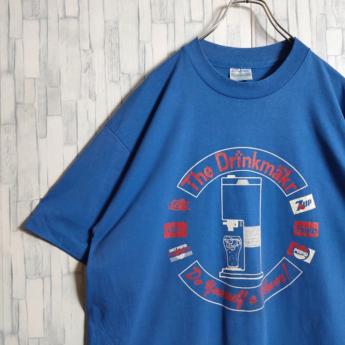 古着】80s アメリカ製 ヘインズ Tシャツ 企業ロゴ アート柄 ブルー