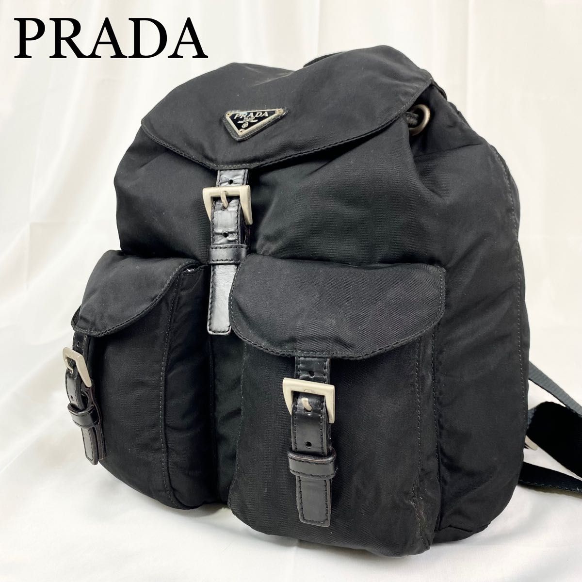 PRADA ミニリュック 三角ロゴ 白タグ フラップ ナイロン 巾着 ブラック-