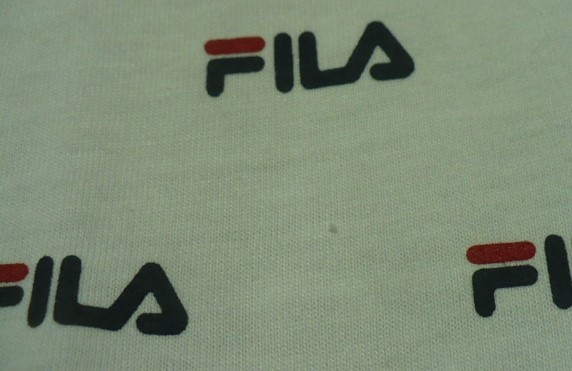 新品紙タグ付き未使用品　FILA(フィラ)製(無数メーカーロゴプリント柄丸首)半袖Ｔシャツ　Ｌ　白×黒　FH7337_画像5