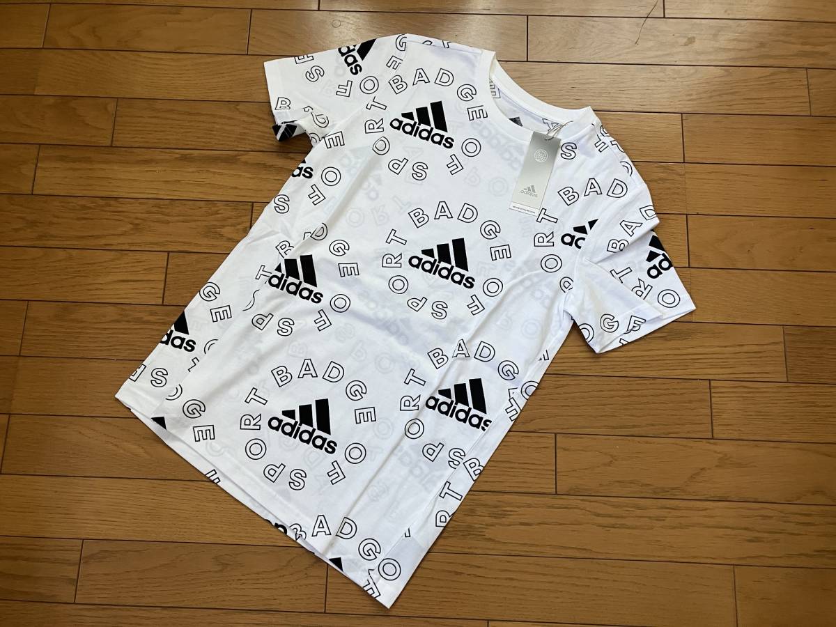 ♪新品タグ付 アディダスadidas ロゴ 総柄プリント 半袖Tシャツ 定価3,950円　白 OT_画像1