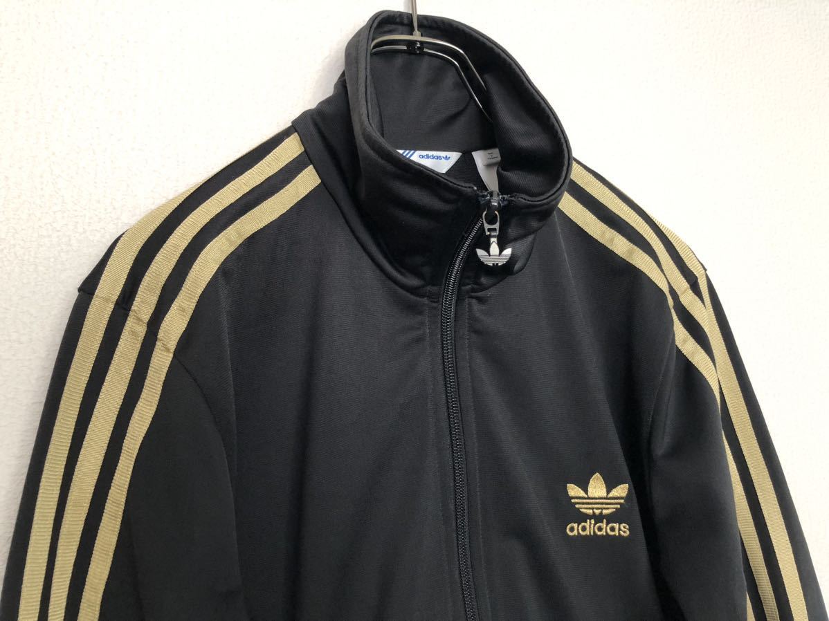 adidasオリジナルス トラックジャケット トラックトップ ジャージ 黒金