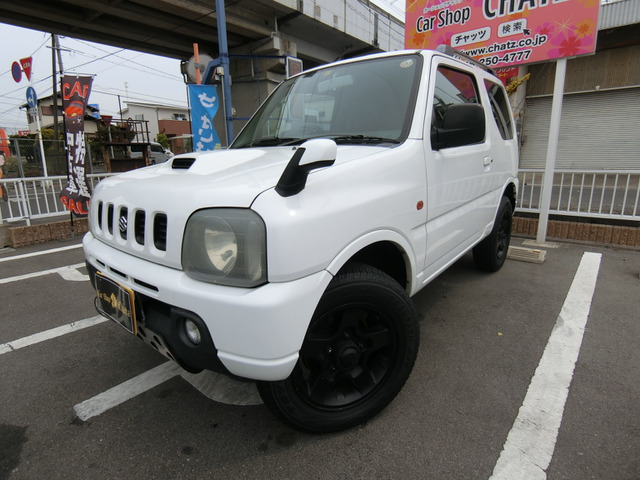 「返金保証付:平成13年 スズキ ジムニー XC 4WD ターボ 外品16AW 外品マフラー@車選びドットコム」の画像1