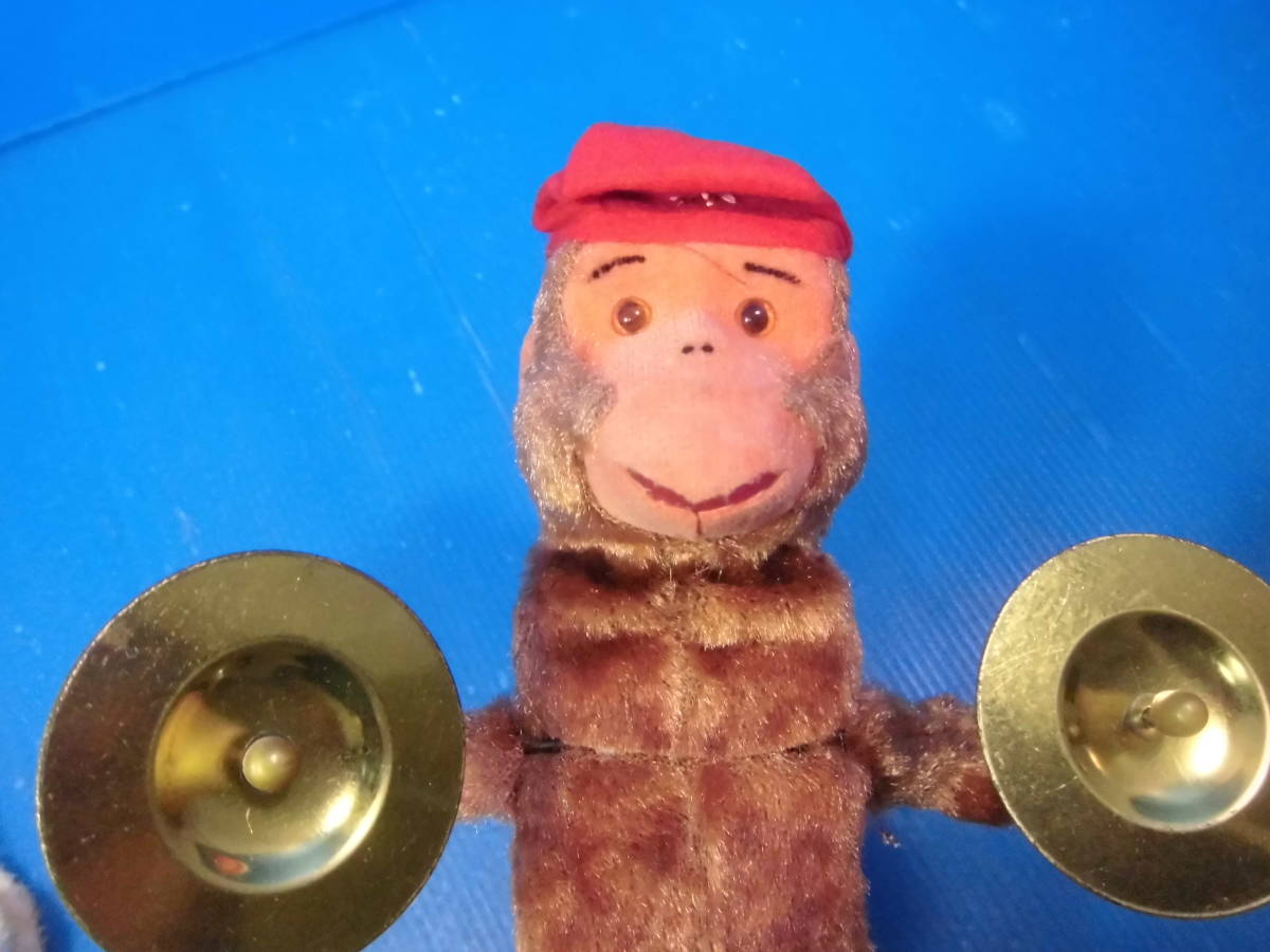 *zen my device /. monkey san . top and bottom . movement while cymbals . beater. ( perhaps made in China )